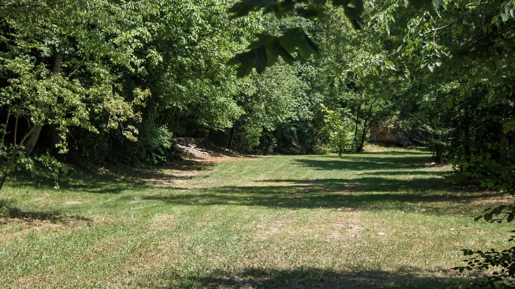 pitch in meadows next to alpine river