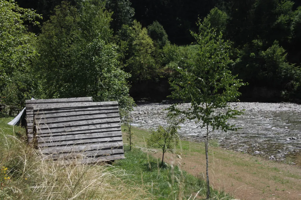 Pitch in a clearing on terrace with river view